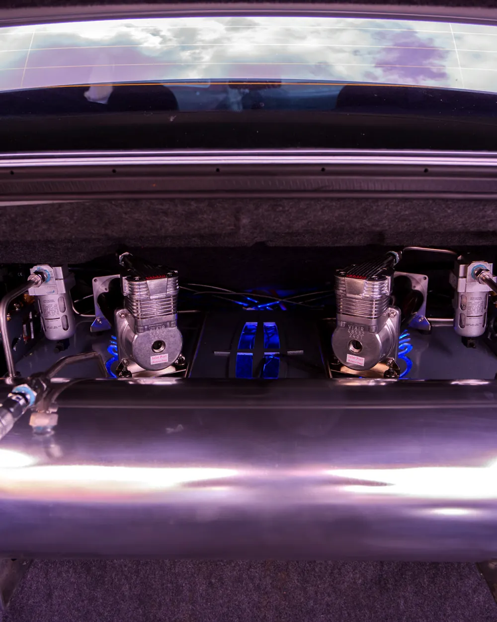 Chrome hydraulic pumps and tank installed in a trunk
