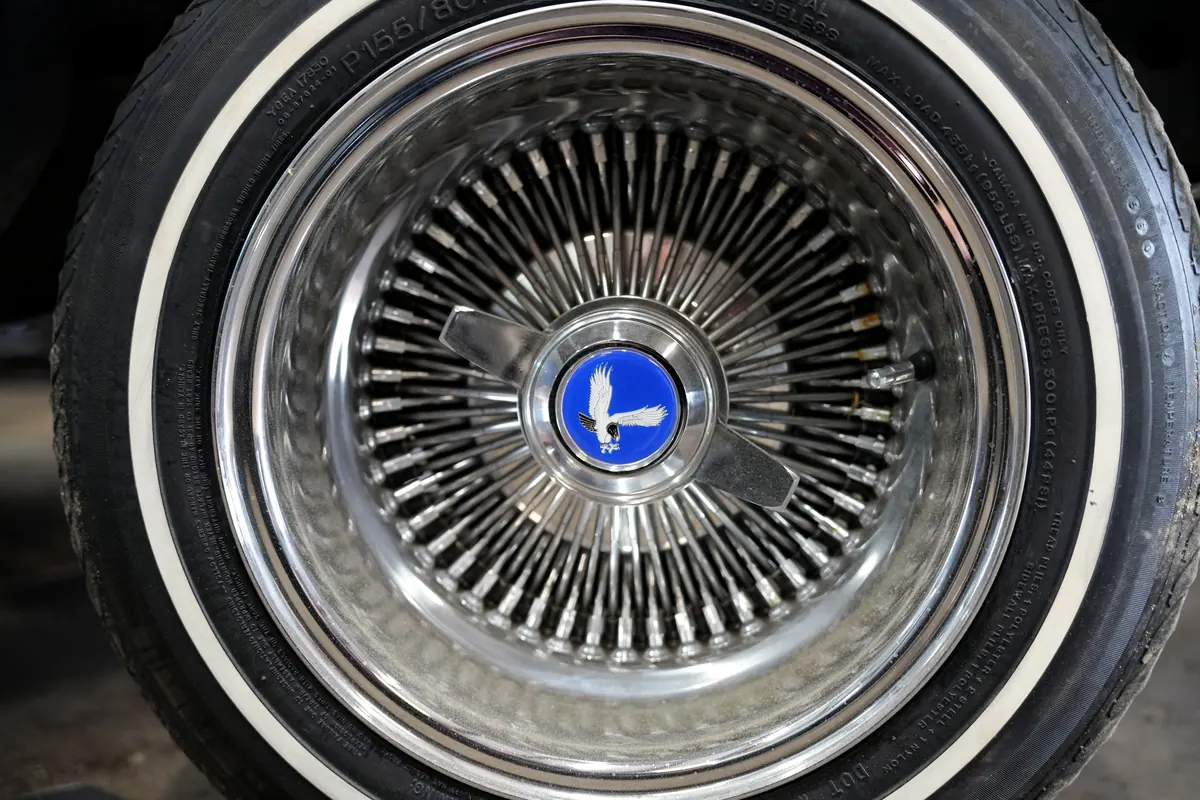 Chrome wire wheel with whitewall tire